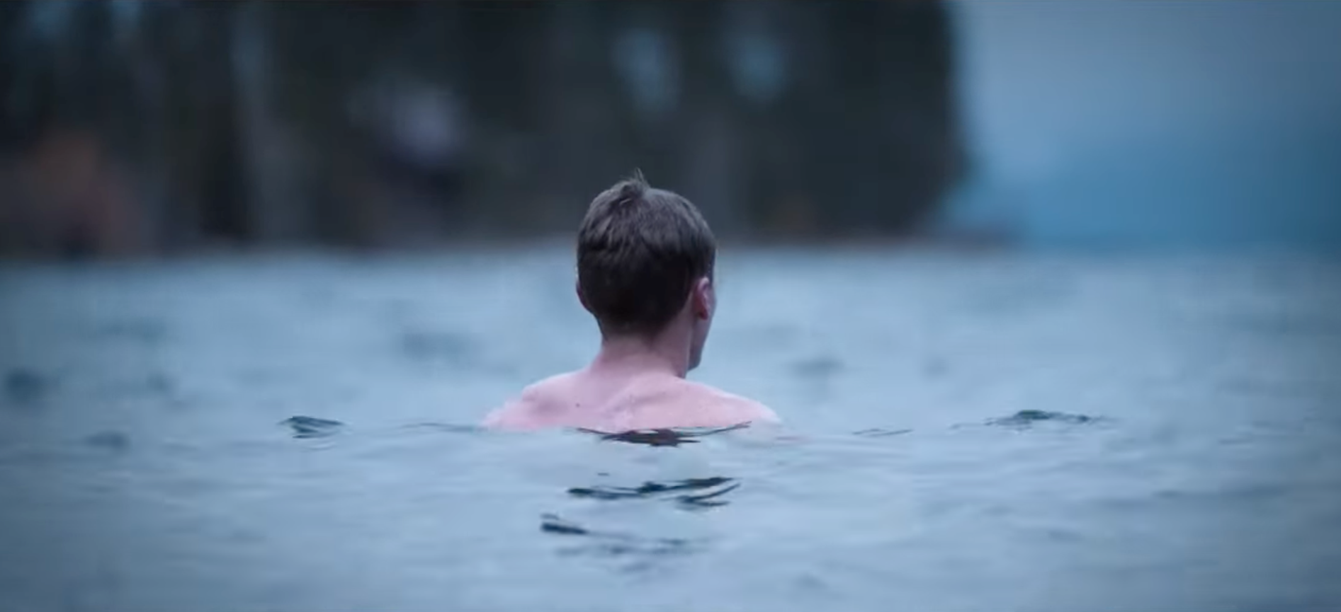 cold plunge in winter lake after sauna